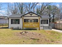 Charming renovated single-story home with a quaint front porch and well-maintained landscaping at 2494 Baxter Rd, Atlanta, GA 30315