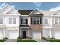 Charming townhome showcasing brick facade, black shutters, manicured lawn, and attached garages at 321 Skye Ln # 53, Cartersville, GA 30121