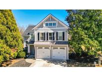 Charming two-story home showcasing a double garage and well-maintained landscaping, with a mix of stone and wood accents at 103 Patrick Way, Marietta, GA 30064