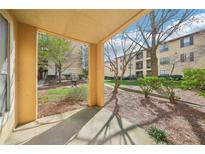 View from the covered patio to the manicured lawn and building at 3777 Peachtree Ne Rd # 1007, Atlanta, GA 30319