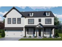 Charming two-story home with white siding, dark accents, a covered porch, and a two-car garage at 3870 Ivy Cottage Dr, Snellville, GA 30039