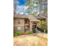 Charming townhome featuring a welcoming entryway and a well-maintained exterior with fresh neutral paint scheme at 8740 Roswell Rd # 5G, Sandy Springs, GA 30350