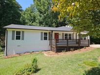 Charming single-story home with a newly renovated front porch and landscaped yard at 147 Mildred Ct, Dallas, GA 30157