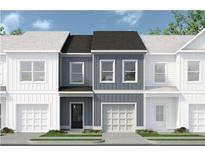 Charming two-story townhome with a light-blue facade, black door, white garage door, and gray roof, adding curb appeal at 48 Alameda St # 129, Loganville, GA 30052