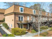 Brick townhouse with landscaped grounds, private balcony and cozy backyard spaces at 1261 Lavista Ne Rd # E9, Atlanta, GA 30324