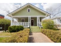 Charming green craftsman home with a cozy front porch and well-maintained landscaping at 338 Clifford Ne Ave, Atlanta, GA 30317