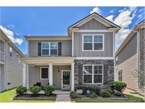 Charming two-story home with stone accents and well-maintained landscaping at 847 Venture Sw Way, Atlanta, GA 30331