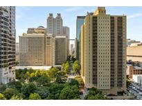 Atlanta skyline view with mature trees and multiple high-rise buildings at 300 Peachtree St # 23-A, Atlanta, GA 30308