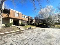 Charming multi-level townhome featuring a cozy facade and inviting landscaping at 3078 Parc Lorraine, Lithonia, GA 30038