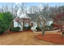 Charming single-Gathering home with a mix of brick and siding, complemented by lush landscaping at 9135 Woodhaven Way, Mcdonough, GA 30253