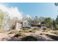 Charming home featuring a welcoming front porch and a gazebo on a well-maintained lot at 31 Wyngate Ct, Dallas, GA 30157