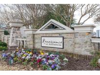 Stone Renaissance at Southpark community sign with colorful flower bed at the base of the monument sign at 5316 Radford Loop, Fairburn, GA 30213