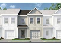 Charming townhome featuring a modern facade, private garage, and beautifully landscaped front yard at 44 Alameda St # 130, Loganville, GA 30052