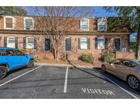 Charming brick townhome with black shutters and a neatly maintained front entrance at 1261 Lavista Ne Rd # B3, Atlanta, GA 30324