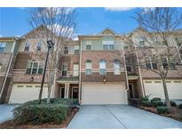 Beautiful brick townhouse with attached garages and meticulously maintained landscaping at 2402 Palladian Manor Se Way # 3, Atlanta, GA 30339