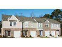 Modern townhome exterior featuring brick facade, attached garages, and neutral color palettes at 626 Jervis Way, Locust Grove, GA 30248