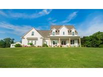 Stunning two-story home features a welcoming front porch and well-manicured lawn at 774 Forrester Cemetery Rd, Covington, GA 30014