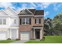 New brick townhome featuring a one-car garage and manicured lawn at 314 Skye Ln # 64, Cartersville, GA 30121