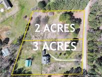 Aerial view of a 5-acre lot split into 2 and 3 acres, perfect for building your dream home or investment property at 3121 Cox Cemetery Rd, Social Circle, GA 30025