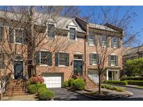 Charming brick townhome with attached garage and mature landscaping at 238 15Th Ne St # 18, Atlanta, GA 30309
