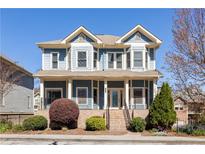 Charming two-story home featuring a welcoming front porch and a beautifully landscaped front yard at 640 Irwin Ne St, Atlanta, GA 30312