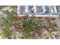 Aerial view of wooded homesite, adjacent to townhomes, offering a serene and private building location at 2469 Stone Rd, East Point, GA 30344
