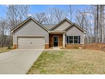 Charming single-story home featuring stone accents, neutral siding, and an attached two-car garage at 248 Oaken Bucket Dr, Temple, GA 30179