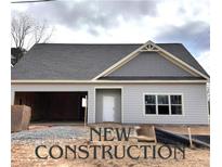 New construction home featuring light gray siding, gray shingles, and an attached two car garage at 4755 Fowler St, Acworth, GA 30101