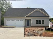 Charming single story home featuring a spacious two car garage and a classic craftsman exterior at 4755 Fowler St, Acworth, GA 30101