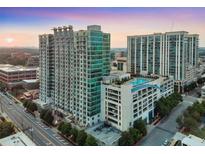 Stunning high-rise building with modern architectural design and rooftop pool, perfect for city living at 250 Pharr Ne Rd # 318, Atlanta, GA 30305