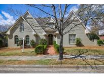 Charming home showcasing a brick walkway, well-manicured lawn, and beautiful architecture at 5 Coventry Close, Avondale Estates, GA 30002