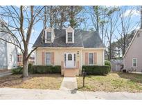 Charming bungalow-style home with dormer windows, a well-manicured yard, and a welcoming front porch at 34 Kelso At Peyton Dr, Atlanta, GA 30311