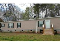 Charming single-story home with neutral siding, black shutters, and a welcoming front entrance at 17 Wildflower Cv, Carrollton, GA 30116