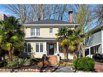 Attractive two-story home with manicured landscaping, brick accents, and mature trees at 1446 High Point Ne Pl, Atlanta, GA 30306