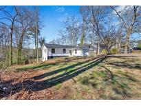 Charming renovated home with a new roof and inviting exterior, nestled on a spacious lawn at 383 Oakridge Se Dr, Cartersville, GA 30121