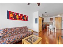 Bright living area with hardwood floors and an open floor plan to the kitchen space at 898 Oak Sw St # 3222, Atlanta, GA 30310