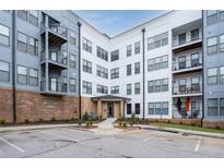 Contemporary apartment building with balconies, covered entryway and ample parking at 898 Oak Sw St # 3222, Atlanta, GA 30310