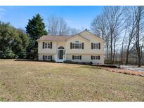 Charming home with a well-maintained lawn and traditional architectural details at 4312 Daniel Dr, Winston, GA 30187