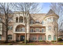 Elegant multi-story building with brick facade, balconies, and architectural details at 423 Georgia Se Ave # 301, Atlanta, GA 30312