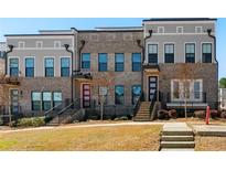 Charming townhome showcasing a classic brick facade and inviting curb appeal at 2125 Burnside Nw Dr, Atlanta, GA 30318