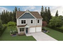 Charming two-story home with two-car garage and beautifully landscaped front yard at 11841 Rizvan Pl, Covington, GA 30014