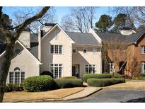 Charming two-story home with meticulously landscaped front yard and neutral color palette at 39 Paces West Nw Dr, Atlanta, GA 30327