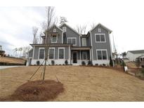 Charming gray two-story home with white trim and manicured lawn at 1975 Sage Lake Bend Sw, Marietta, GA 30064