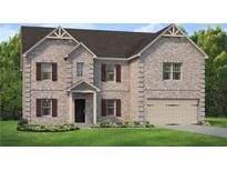Charming two-story brick home with a well-manicured lawn and a two-car garage at 177 Haverling Pass, Hampton, GA 30228