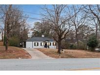 Charming home with a well-maintained exterior and a driveway leading up to the front of the house at 1013 Columbia Dr, Decatur, GA 30030