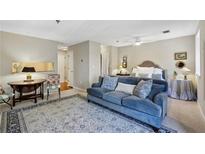 Bright, open floor plan with elegant decor and plush blue sofa adds charm at 300 Johnson Ferry Ne Rd # A313, Atlanta, GA 30328