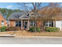Charming brick home featuring well-maintained landscaping and inviting front entrance at 3310 Raes Creek Rd # 16, Marietta, GA 30008