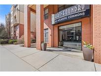 Inviting entrance to The Art Foundry at Atlantic Commons, featuring brick accents and modern architecture at 400 17Th Nw St # 2025, Atlanta, GA 30363