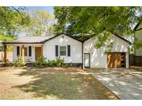 Charming single-story home featuring a newly paved driveway and inviting front porch at 1377 Marston St, Smyrna, GA 30080