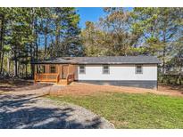 Charming one-story home with a welcoming front porch and a freshly landscaped yard at 4739 Cook Sw Rd, Stockbridge, GA 30281